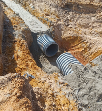 Large-diameter TDR PRO polypropylene storm drain pipe (18–48 in) in trench at West Texas Logistics Center, El Paso, TX