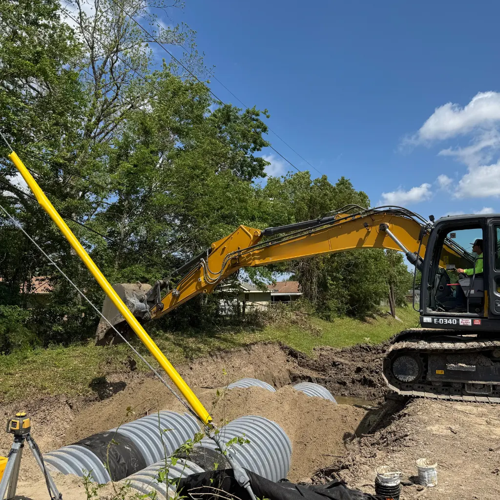 Corrugated polypropylene pipe Austin — TDR PRO PP pipe set to grade beneath paving at Endeavor 290, Austin, TX