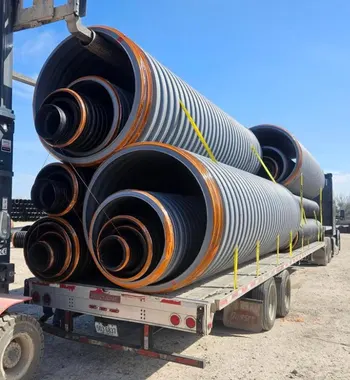 Corrugated polypropylene pipe Fulshear — TDR PRO PP storm pipe set along a residential street at Tamarron West, Fulshear, TX
