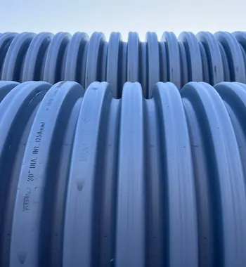 Corrugated polypropylene pipe Fulshear — TDR PRO 18–48 in pipe being installed in a trench at Tamarron West, Fulshear, Texas