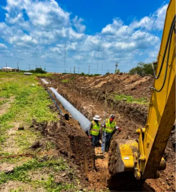 Corrugated polypropylene pipe Huffman — TDR PRO 24–42 in pipe being installed in a trench at Sila community, Huffman, Texas
