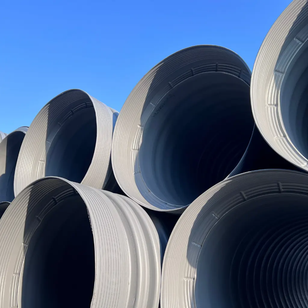 Corrugated polypropylene pipe Socorro — TDR PRO 30–48 in pipe being installed beneath concrete paving at TPA Socorro Logistics, Texas