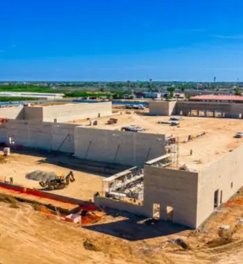 Corrugated polypropylene pipe Weslaco — crew installing TDR PRO corrugated storm drain pipe at the Sam's Club retail site, Weslaco, Texas