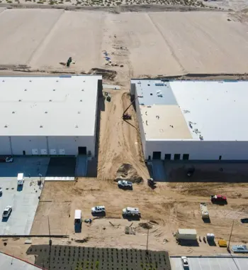 Industrial park drainage El Paso — crew installing TDR PRO corrugated storm drain pipe in Phase I at Camino Real Logistics Park, El Paso, Texas