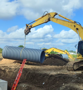 Corrugated polypropylene pipe Katy — TDR PRO® pipe being installed in a trench at Anniston, Katy, Texas