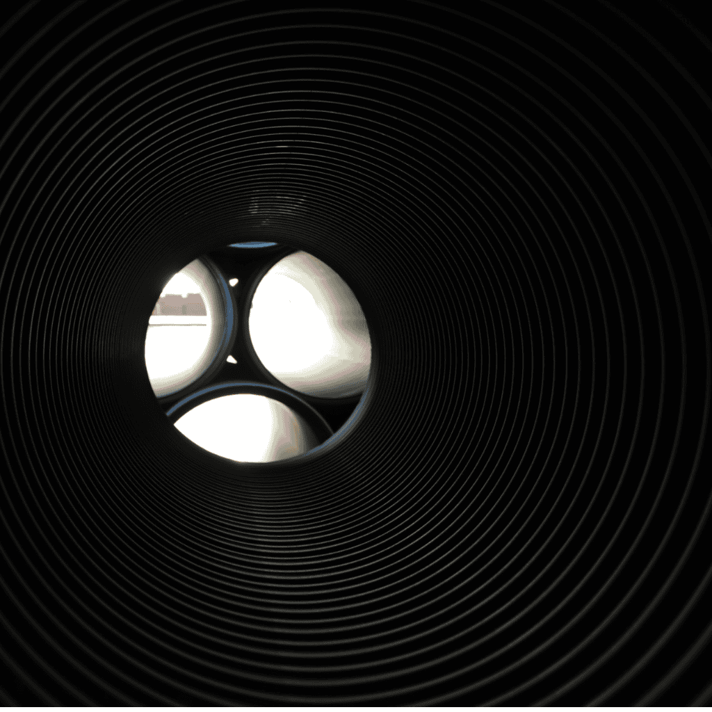 Highway drainage El Paso — TDR ULTRA HDPE high-velocity storm line set beneath the widened Montana Avenue, El Paso, TX