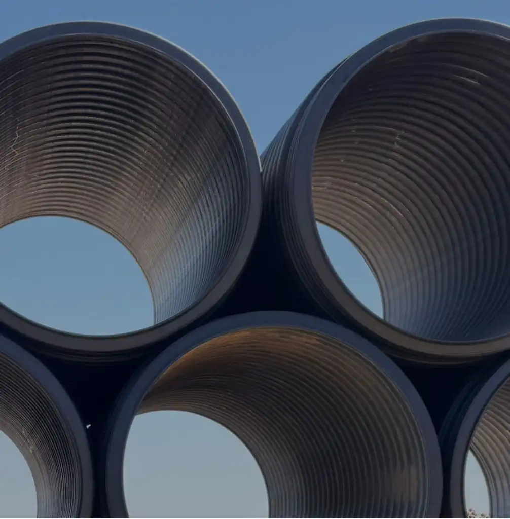 Hotel site drainage Nacogdoches — crew installing TDR ULTRA corrugated HDPE drainage pipe at the four-story Holiday Inn Express, Nacogdoches, Texas